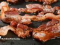 greasy bacon on a hot pan