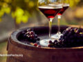Grapes and glasses of red wine